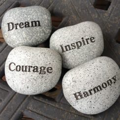 4 stones with inspirational words on them