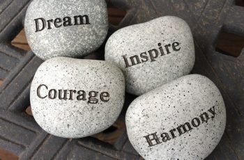4 stones with inspirational words on them