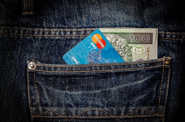 $100 Bill, credit card, in a pocket