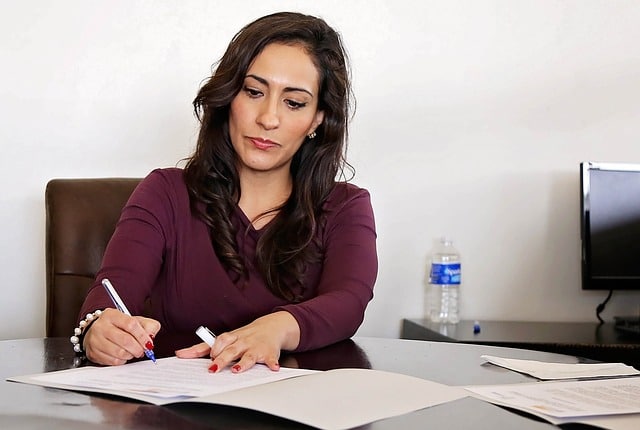 Female Probation Officer, sitting at a desk in a lawyer's office